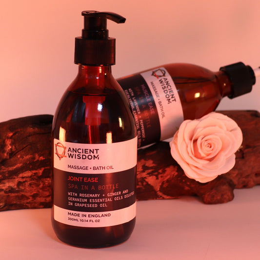 The Bliss Co Joint Ease aromatherapy massage and bath oil, 300ml bottle with pump, showing the product and oil texture.