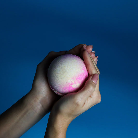 Set of 3 pink lemonade jumbo bath bombs by The Bliss Co, 180g each, featuring vibrant pink and yellow colors for a relaxing bath.