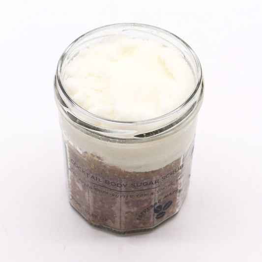 The Bliss Co Fragranced Sugar Body Scrub in Espresso Martini scent, 300g, with textured sugar and elegant packaging visible.