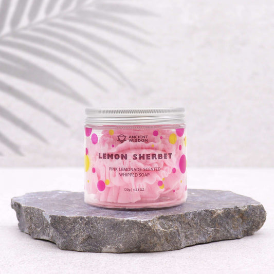 Pink Lemonade Whipped Soap by The Bliss Co, showing a fluffy, pink whipped soap in a jar with a smooth texture.