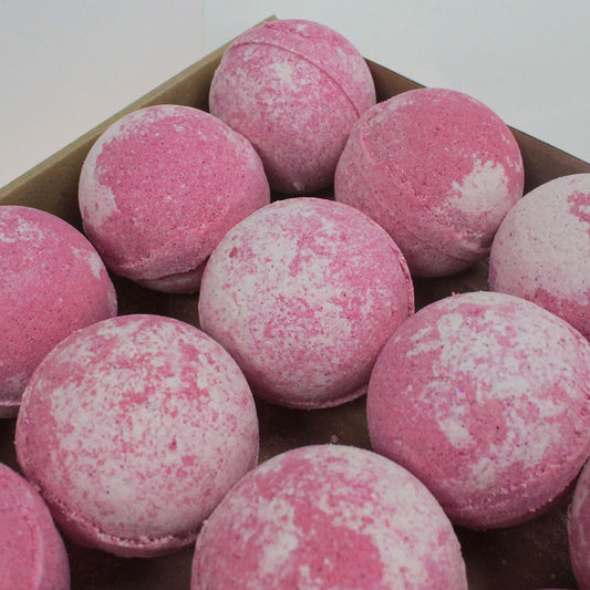 Set of three jumbo cherry bath bombs by The Bliss Co, 180g each, featuring vibrant red color and floral cherry scent.