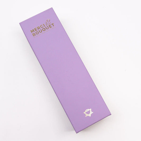 Long box of soap flower gift set featuring lavender, rose, and carnation from The Bliss Co, arranged in a decorative gift box.