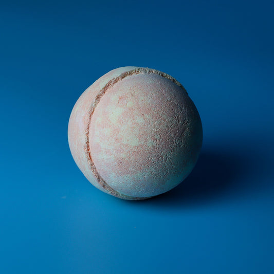 Set of 3 Peach Sangria Jumbo Bath Bombs by The Bliss Co, 180g each, showcasing peach-colored bath bombs in a relaxing spa setting.
