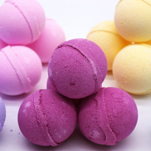 Essential Oil Bath Bomb by The Bliss Co with ylang ylang and ginger for relaxing bath experience.