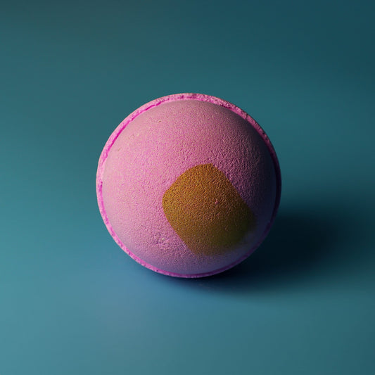 Pink Charlotte Jumbo Bath Bomb by The Bliss Co, 180g, showing a colorful, spherical bath bomb ready for a relaxing bath.