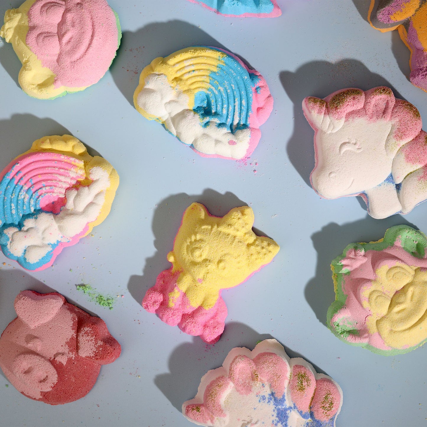 Colorful cat-shaped bath bomb for kids by The Bliss Co, designed to create a fun, fragrant bath experience.