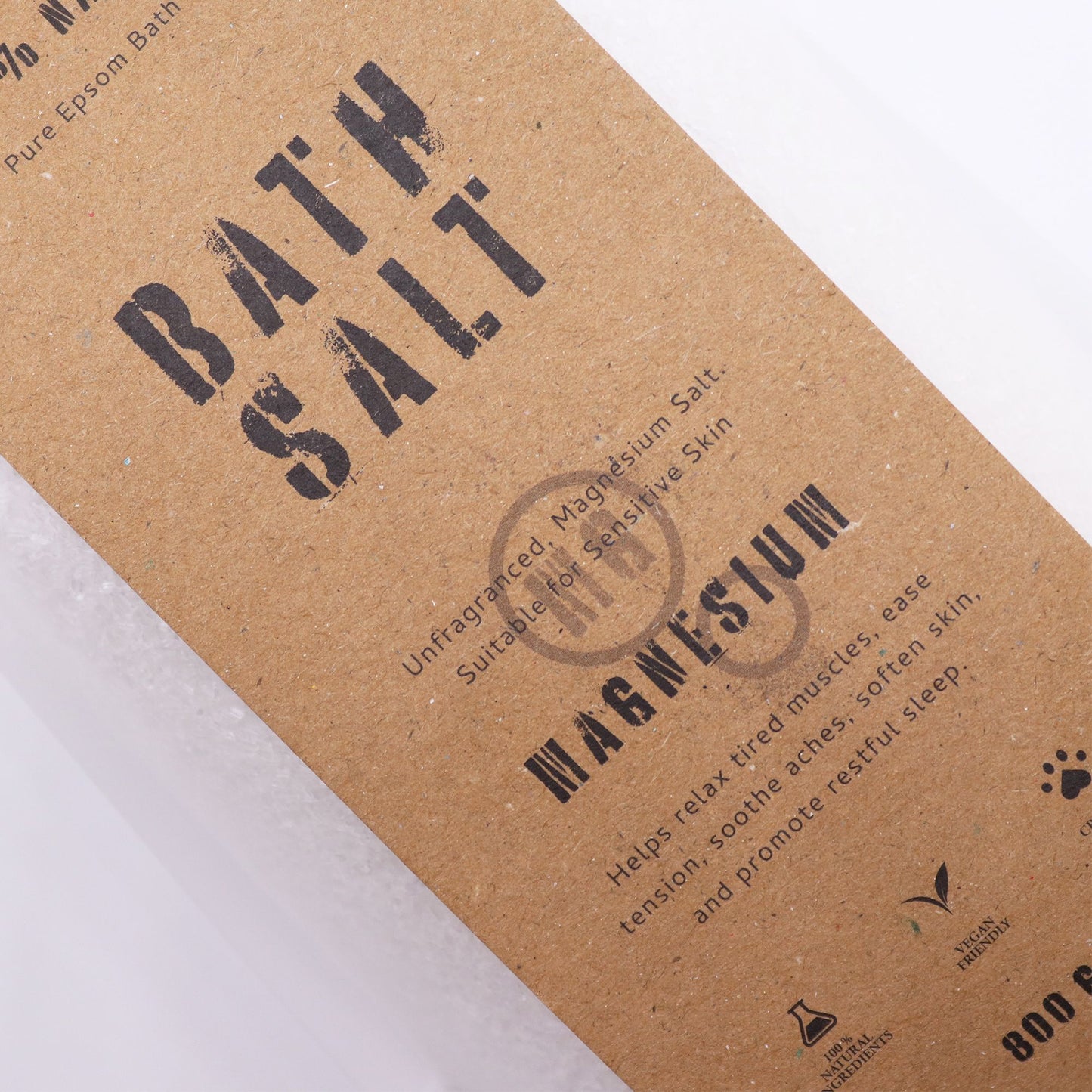 Greenman Rituals Magnesium Epsom Bath Salts by The Bliss Co, showing a jar of green-colored bath salts with natural ingredients.