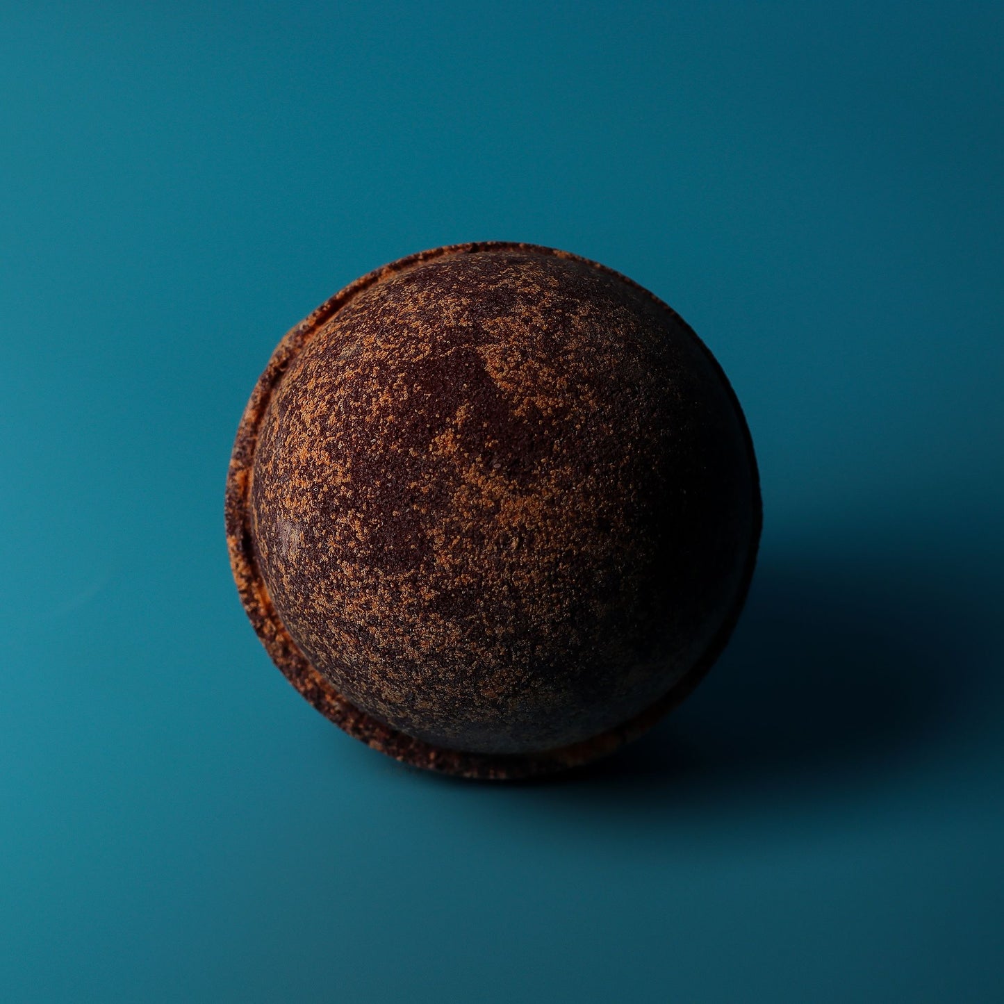 Set of 3 jumbo chocolate and orange bath bombs from The Bliss Co, showing colorful spherical bath bombs with vibrant orange and brown hues.