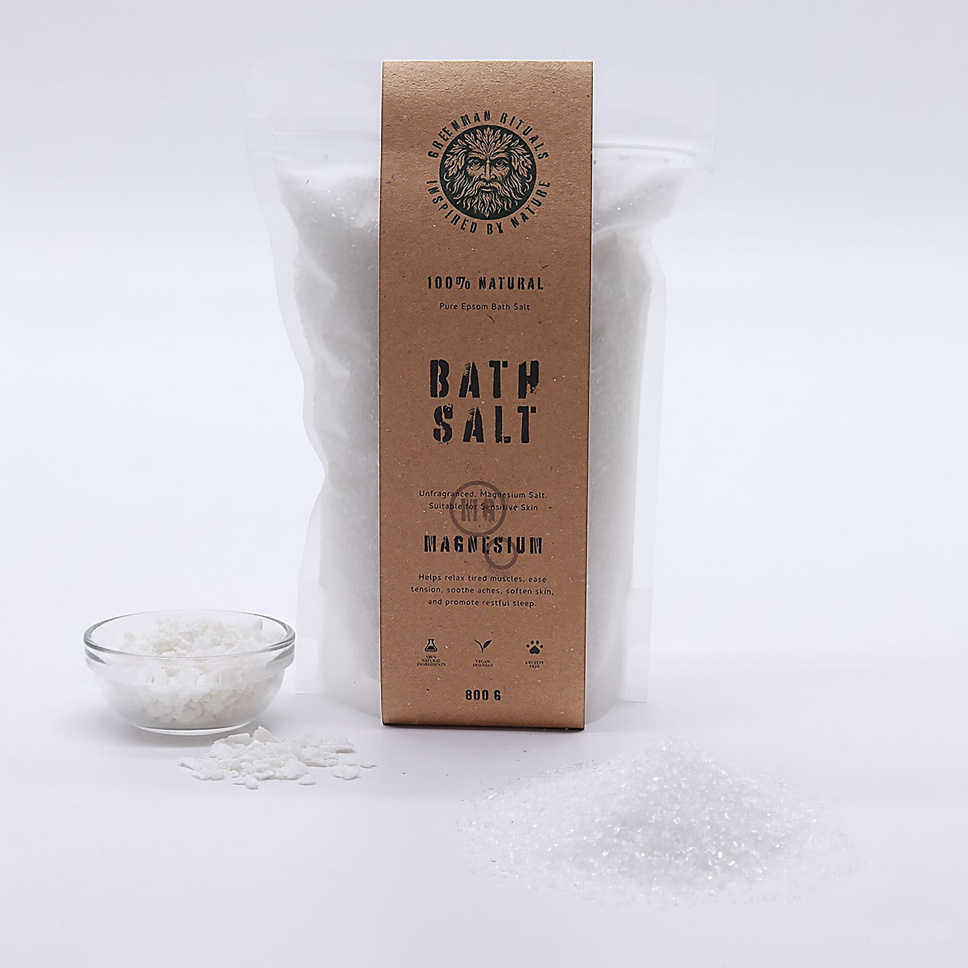 Greenman Rituals Magnesium Epsom Bath Salt from The Bliss Co, showing a white jar with green label and bath salts inside.