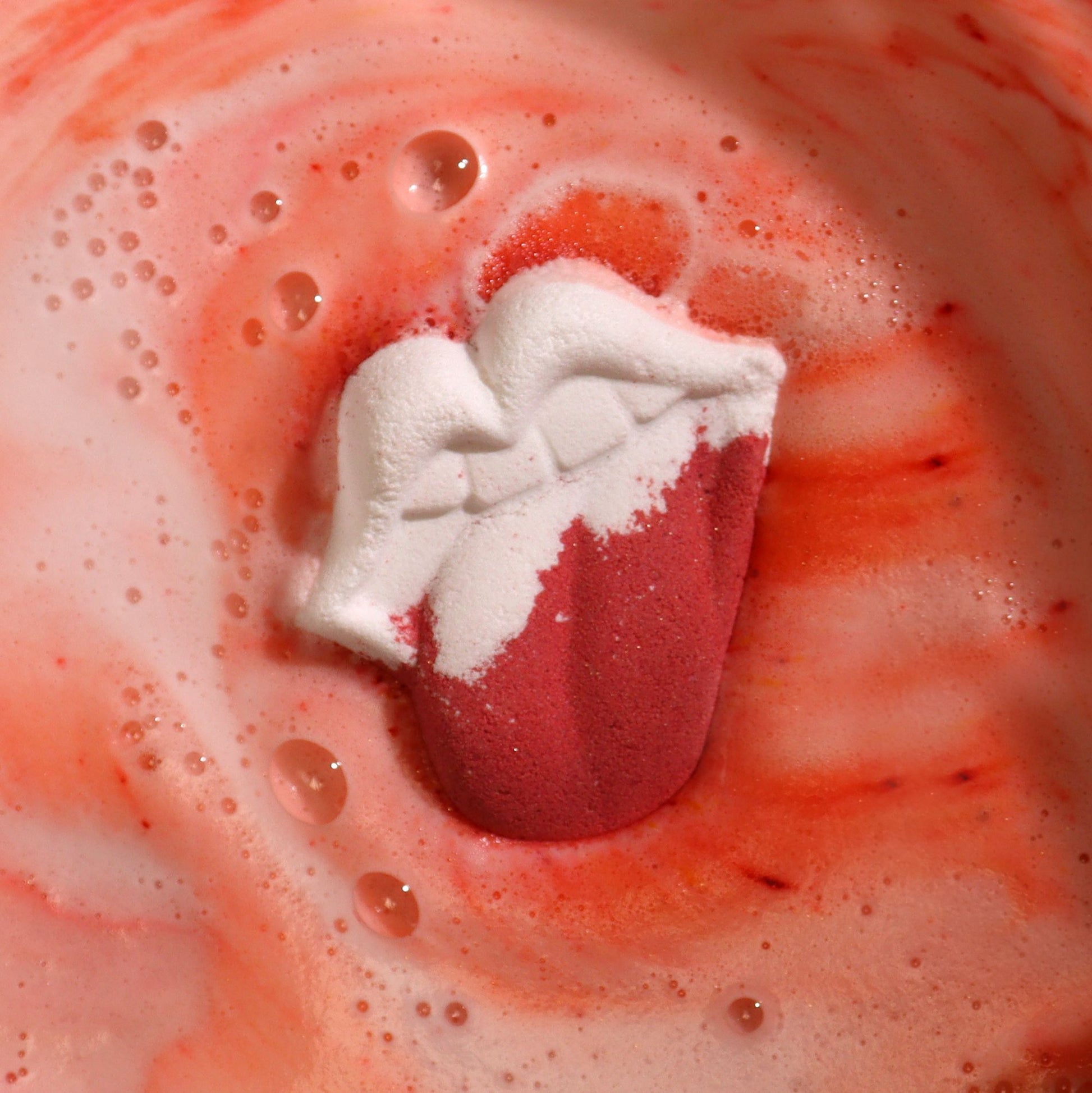 Colorful Lips-shaped bath bomb for kids by The Bliss Co, 60g, designed for fun, relaxing bath experiences.