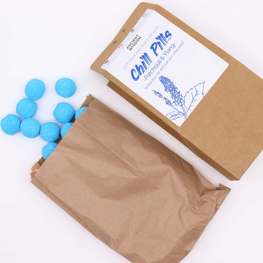 Chill Pills Gift Pack 350g by The Bliss Co with Ylang and Patchouli, featuring colorful herbal supplement capsules in a decorative box.