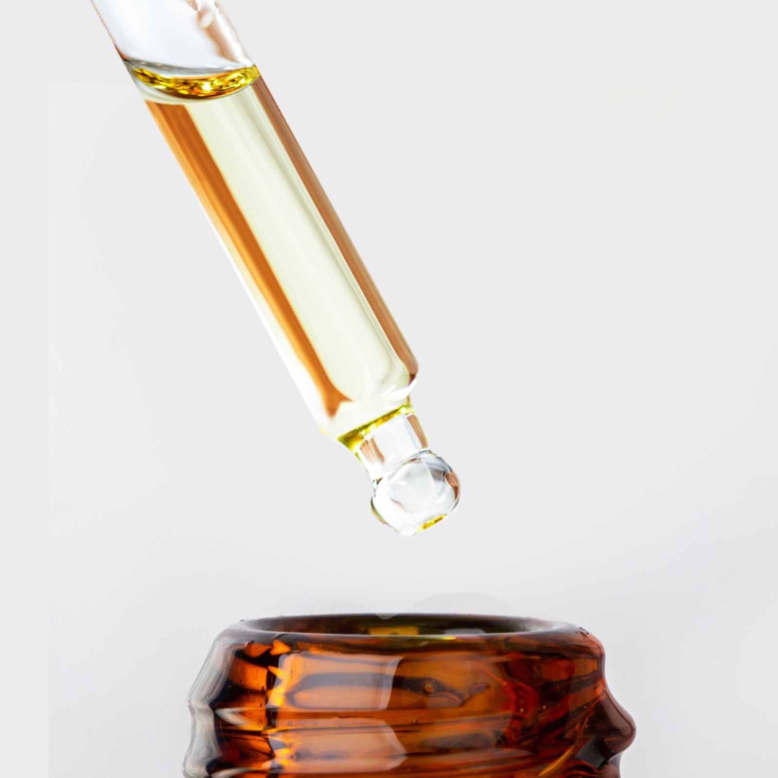 A bottle of The Bliss Co Vitamin C Face Serum, facial serum with brightening and antioxidant properties, on a neutral background.