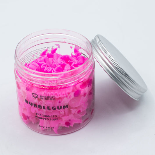 Creamy pink Bubblegum Whipped Soap by The Bliss Co displayed in a jar, showcasing its fluffy, smooth texture and vibrant color.