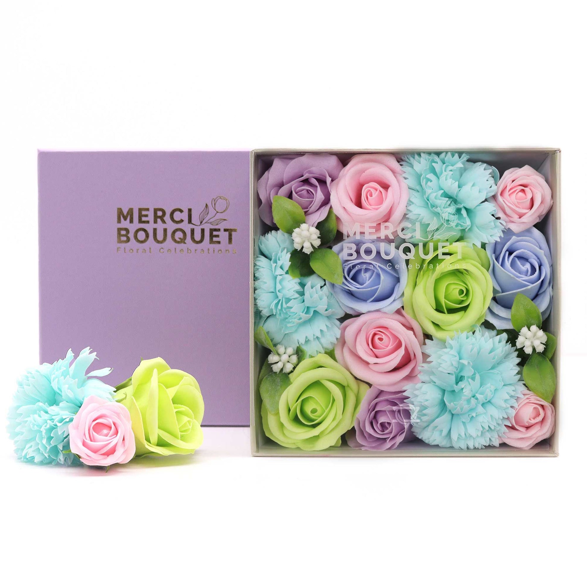 Square box of Baby Blessings soap flower gift box in blues by The Bliss Co, featuring decorative soap flowers in a gift-style arrangement.