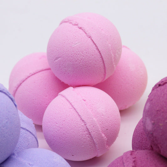 Essential Oil Bath Bomb by The Bliss Co with frankincense and rose, showing a colorful bath bomb with floral and aromatic details.
