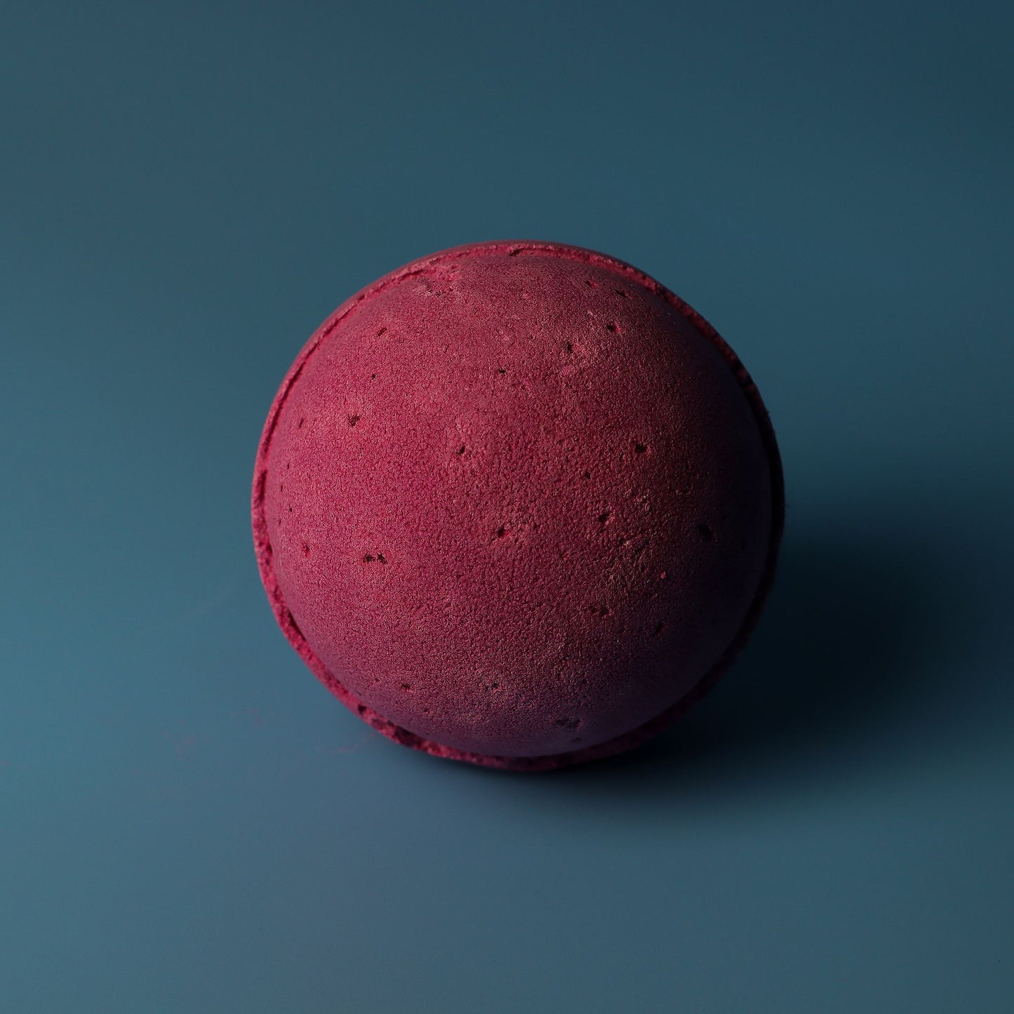Set of three jumbo cranberry-scented bath bombs by The Bliss Co, each 180g, with vibrant red and pink hues for a luxurious bath experience.