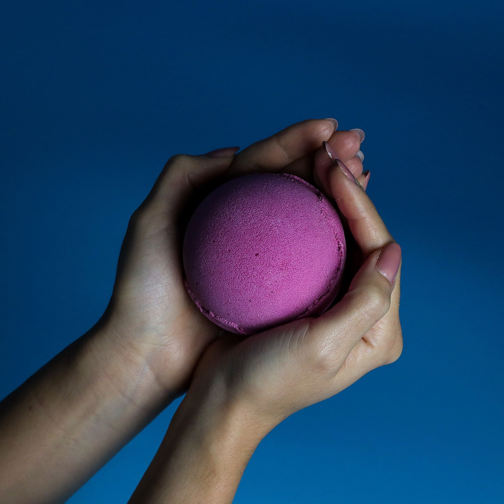 Set of 3 cranberry-scented jumbo bath bombs by The Bliss Co, each 180g, with vibrant red and pink swirling patterns