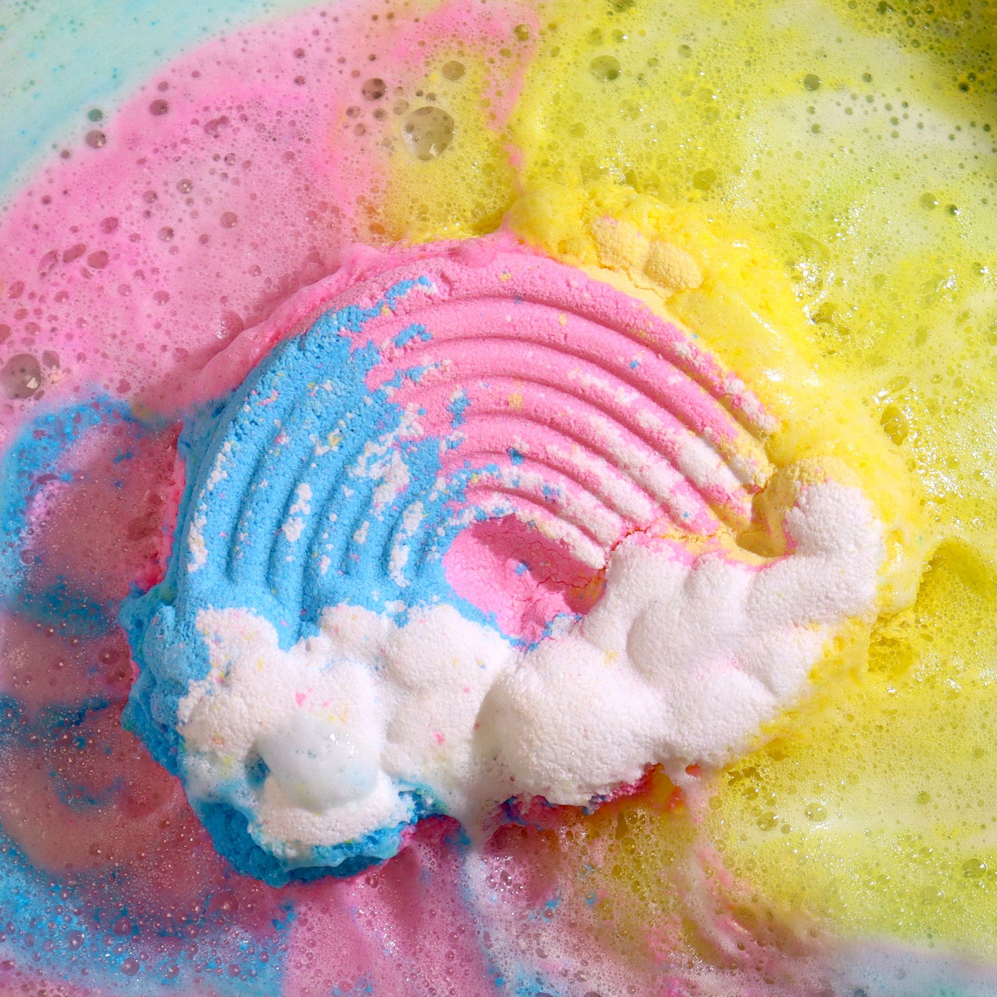 Colorful Cloud-shaped bath bomb for kids by The Bliss Co, 95g, with vibrant swirls and playful design, perfect for bath time fun.