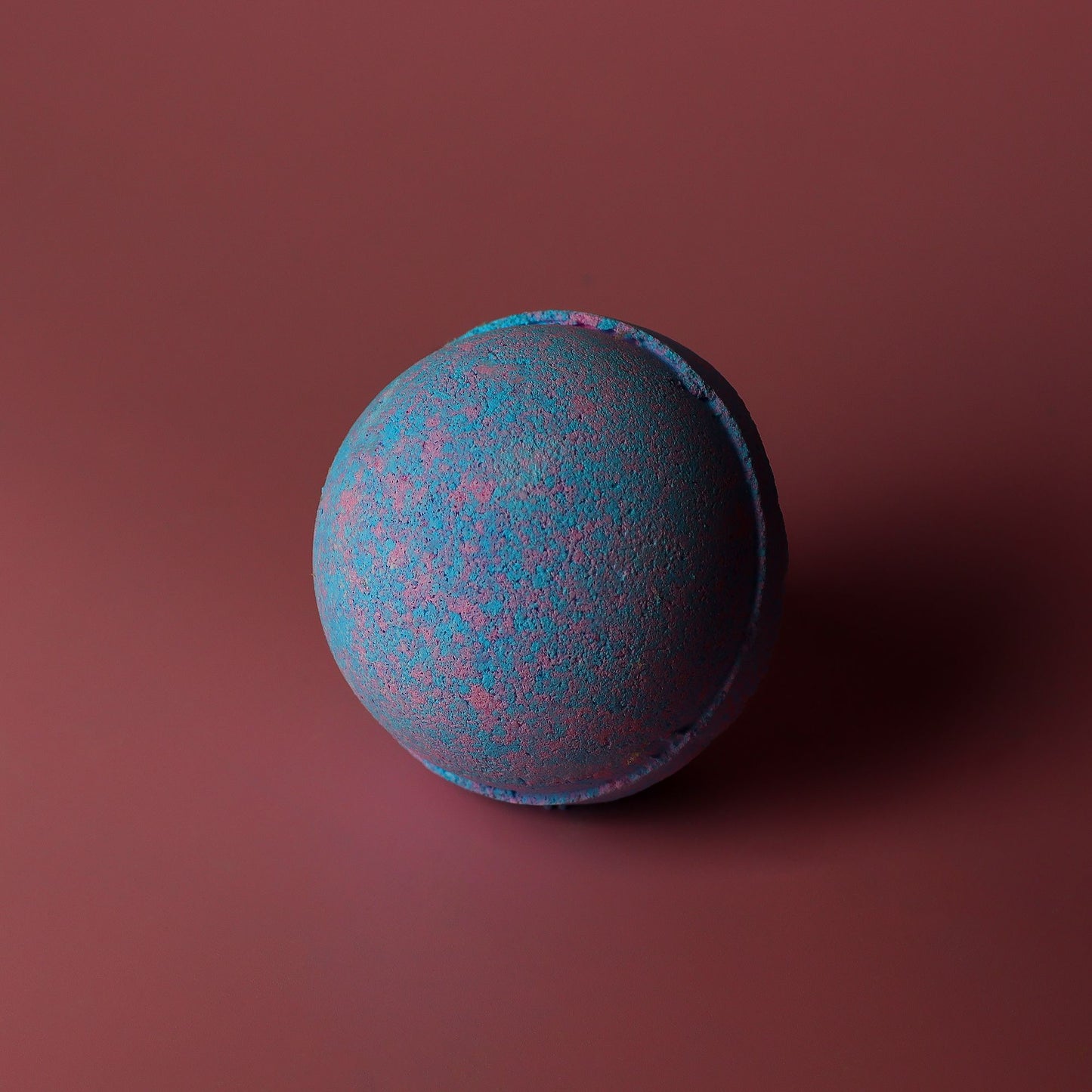 Set of 3 jumbo baby powder scent bath bombs by The Bliss Co, each 180g, with colorful, round bath bomb shapes.