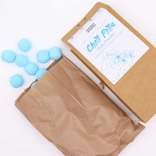 Chill Pills gift pack by The Bliss Co featuring baby powder scented relaxing bath bombs and wellness products.