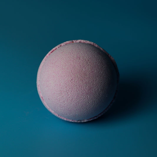 Set of 3 jumbo Bubblegum scented bath bombs from The Bliss Co, each 180g, with colorful, round bath bombs in a relaxing bath setting.