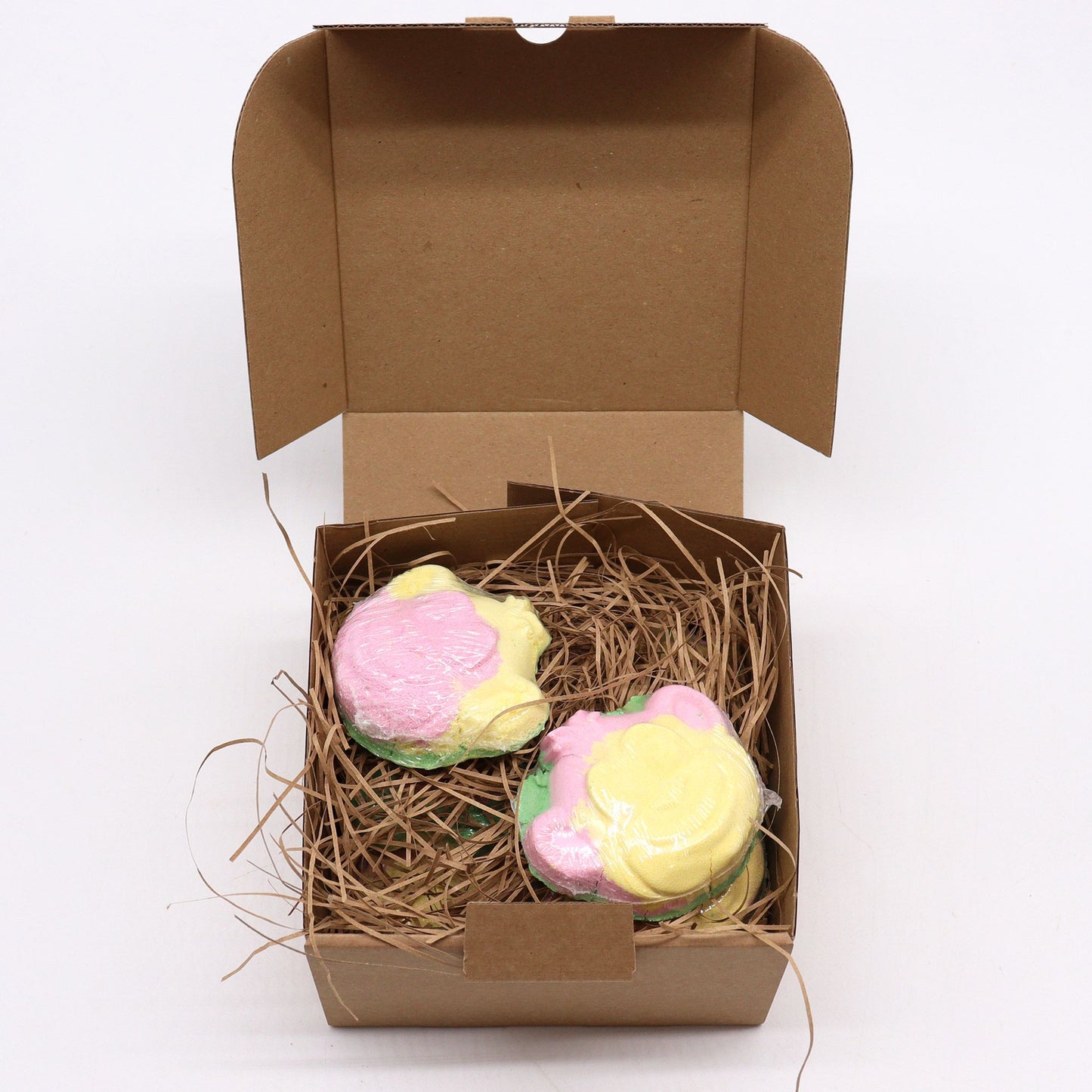 Colorful Monkey-shaped bath bomb for kids by The Bliss Co, 90g, with vibrant swirls and fun design for bath time enjoyment.