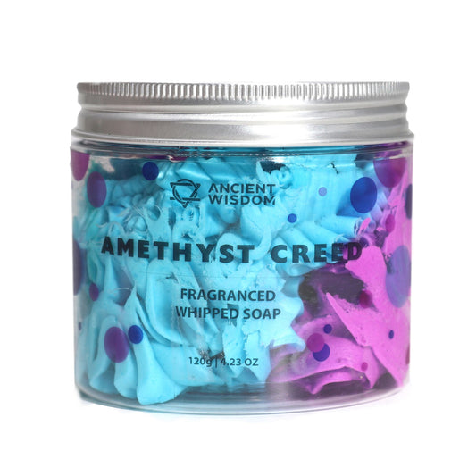 Amethyst Creed whipped soap by The Bliss Co displayed in a 120g container, showcasing its light, fluffy texture with purple hues.