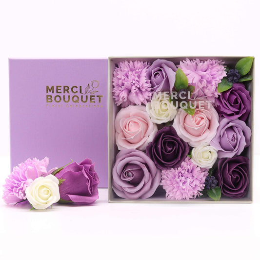 Square box of soap flower gift set by The Bliss Co featuring lavender roses and carnations in a decorative gift box.