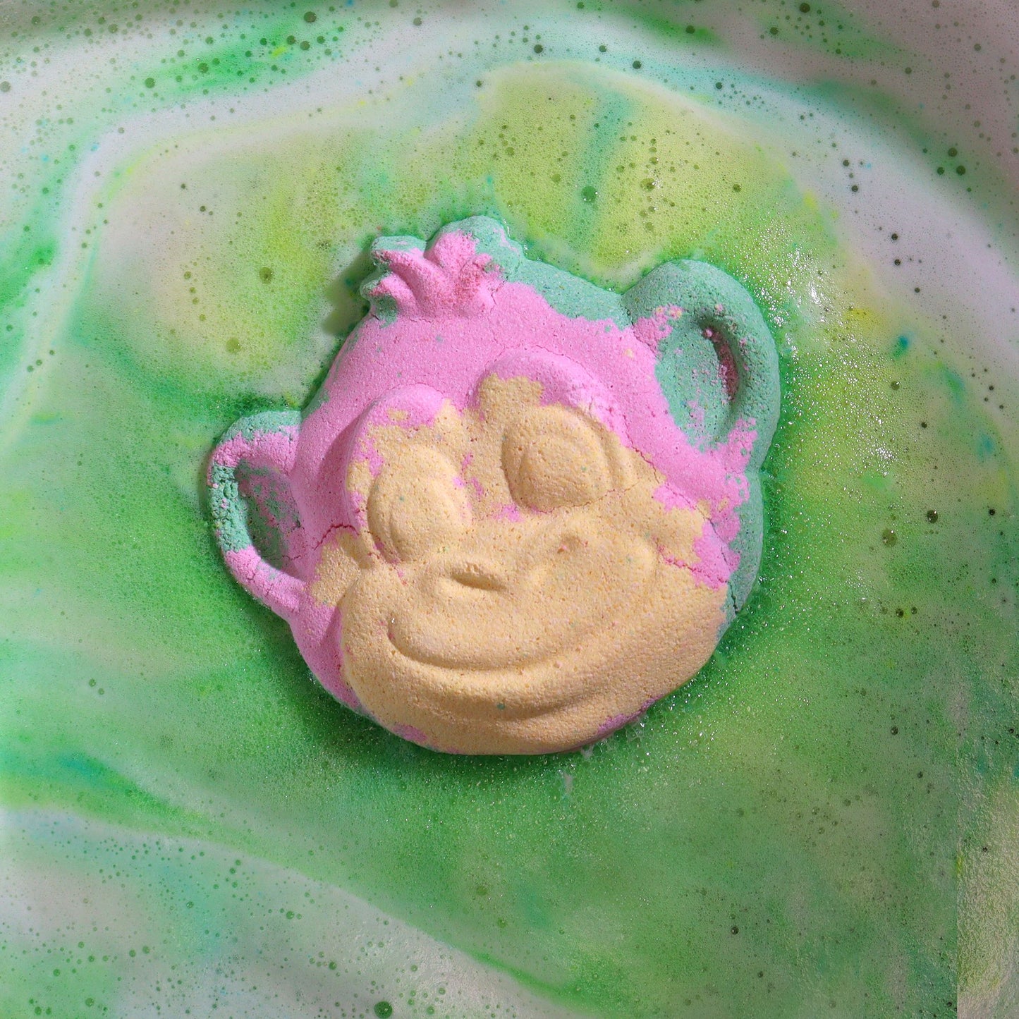 Colorful Monkey-shaped bath bomb by The Bliss Co, designed for kids, with vibrant swirls and playful details in a 90g size.