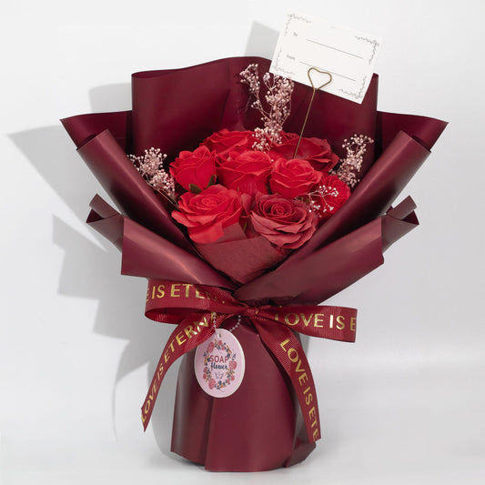 Large red roses bouquet soap flower arrangement by The Bliss Co with a love-themed gift card, perfect for romantic occasions.
