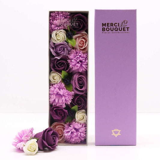 Long box of soap flower gift set with lavender roses and carnations by The Bliss Co, beautifully arranged in a decorative box.
