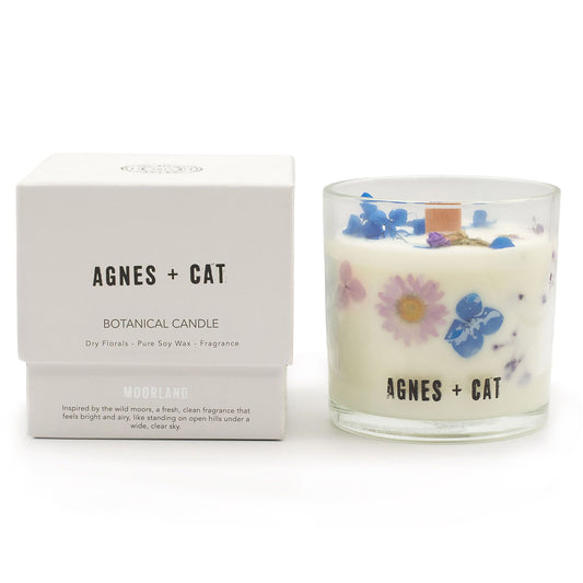 Agnes + Cat Botanical Soy Wax Candle by The Bliss Co featuring a Moorland scent, in a glass jar with a natural aesthetic.