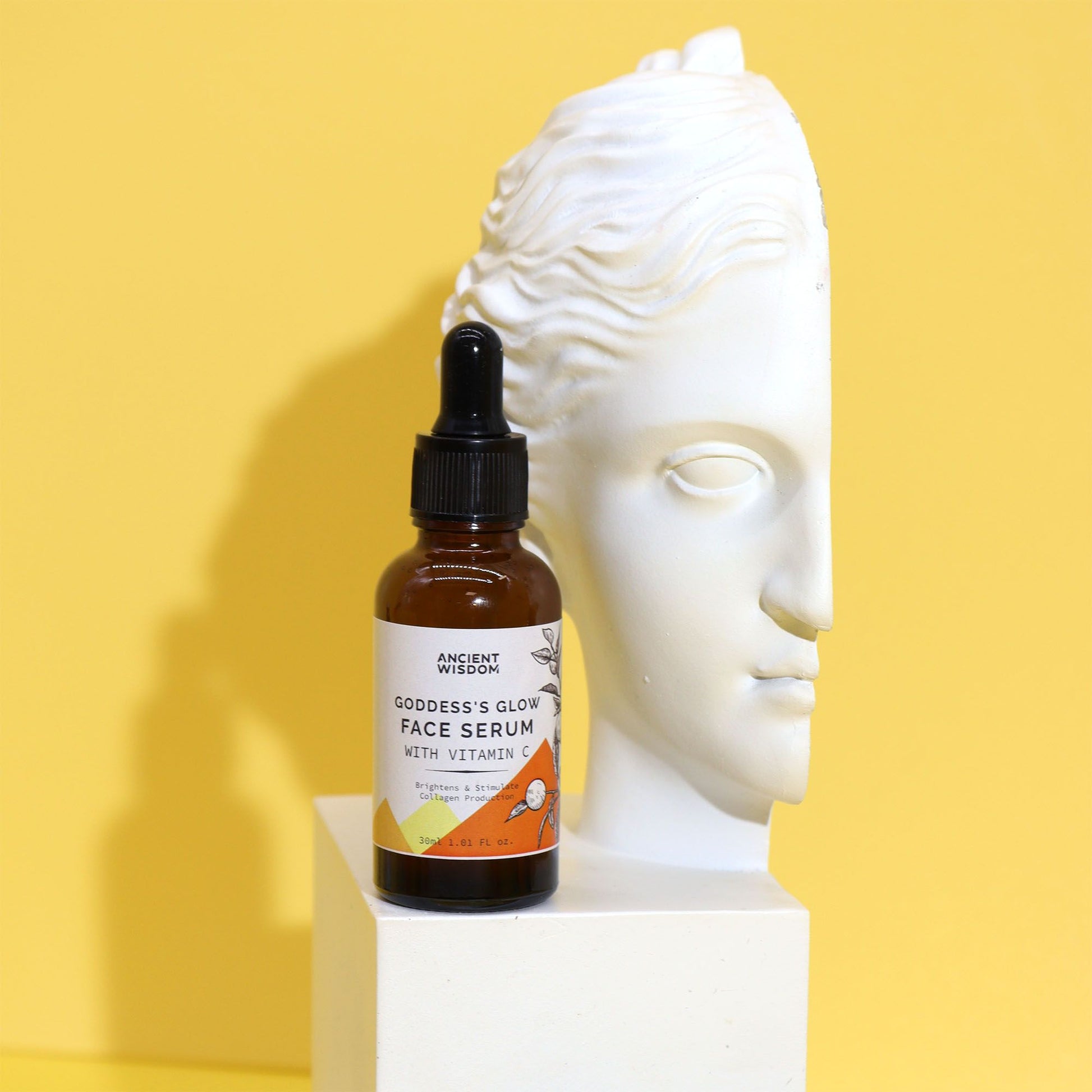 The Bliss Co Goddess’s Glow Face Serum with Vitamin C bottle showing bright, clear serum in a sleek skincare container.