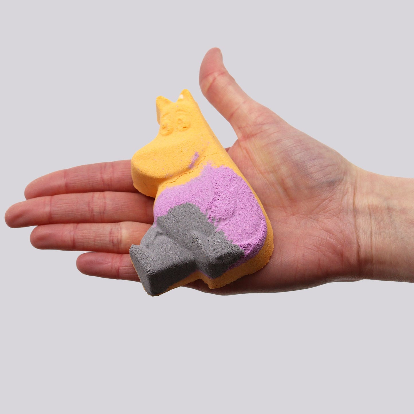 Colorful Hippo-shaped bath bomb for kids by The Bliss Co, 85g, designed to create fun and relaxing bath time experiences.