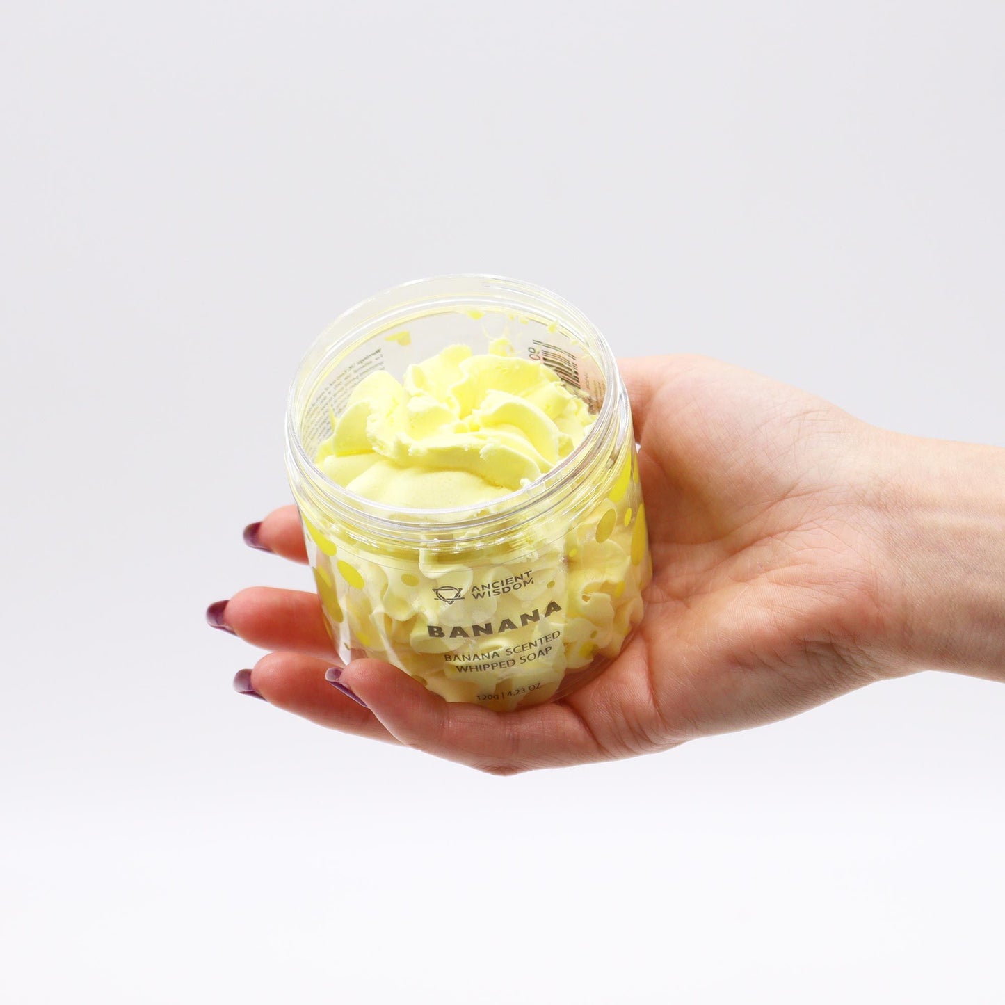 Banana whipped soap by AW Dropship UK in a 120g container, creamy and smooth in appearance, ideal for gentle cleansing.