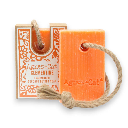 Agnes + Cat Soap on a Rope by The Bliss Co with bright clementine scent, featuring a colorful soap on a hanging rope display.