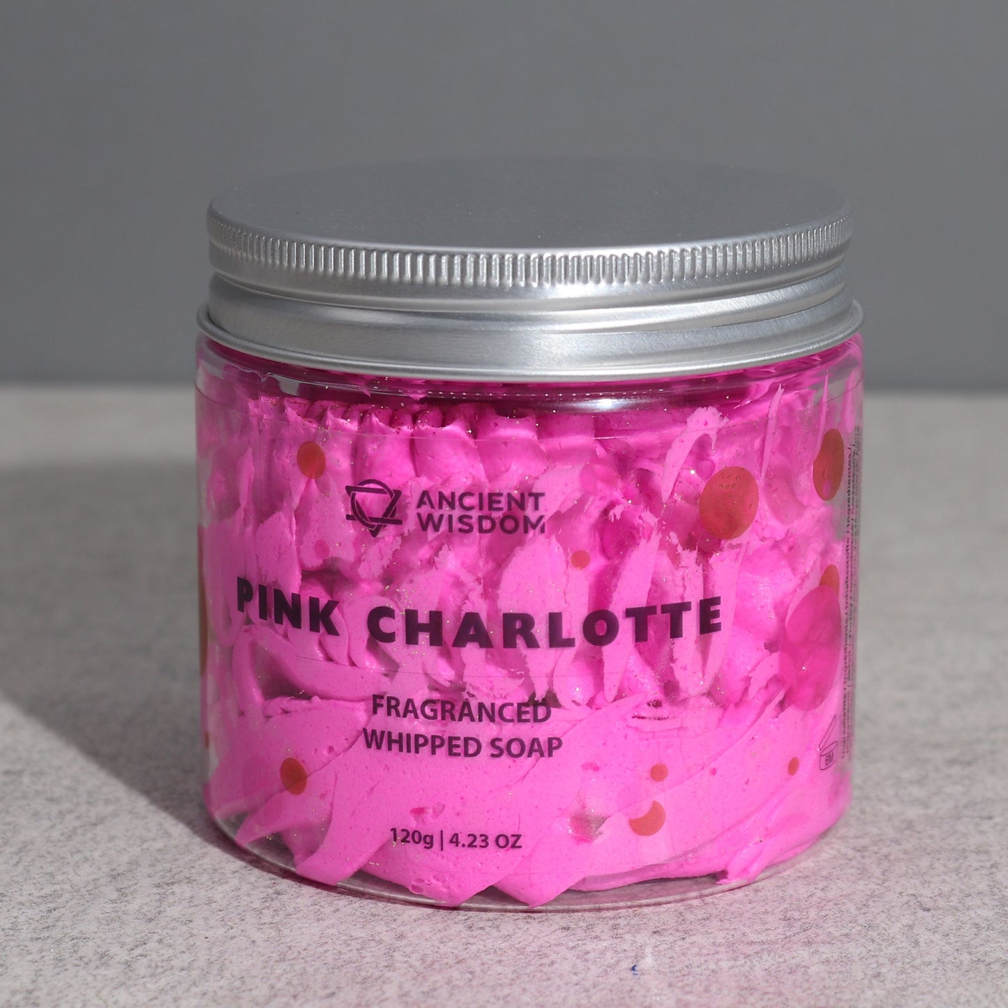 Pink Charlotte whipped soap by The Bliss Co in a 120g jar, showcasing its fluffy, pink whipped texture and luxurious appearance.
