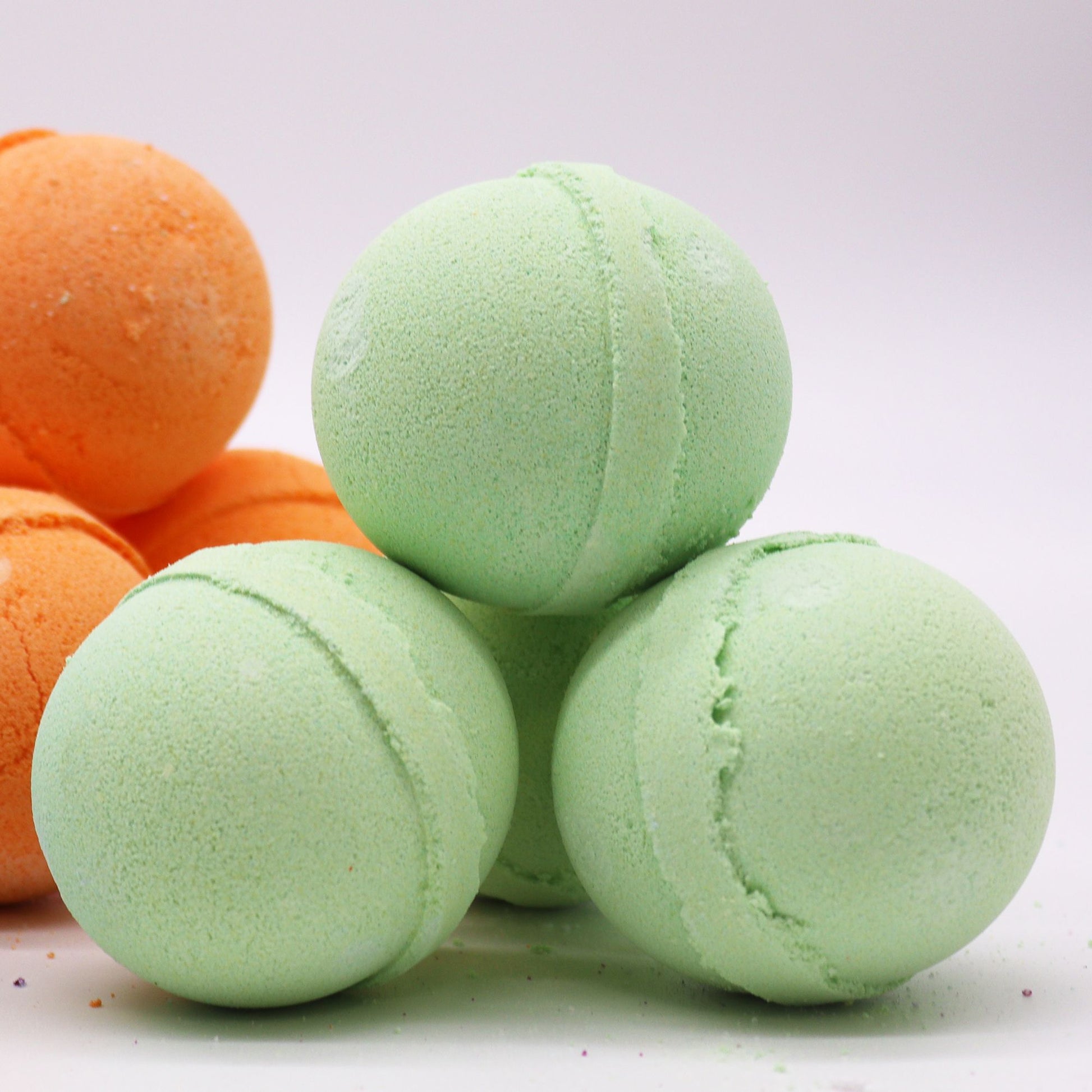 Essential Oil Bath Bomb with rosemary and thyme from The Bliss Co, showing a colorful, aromatic bath bomb with herbs and essential oils.