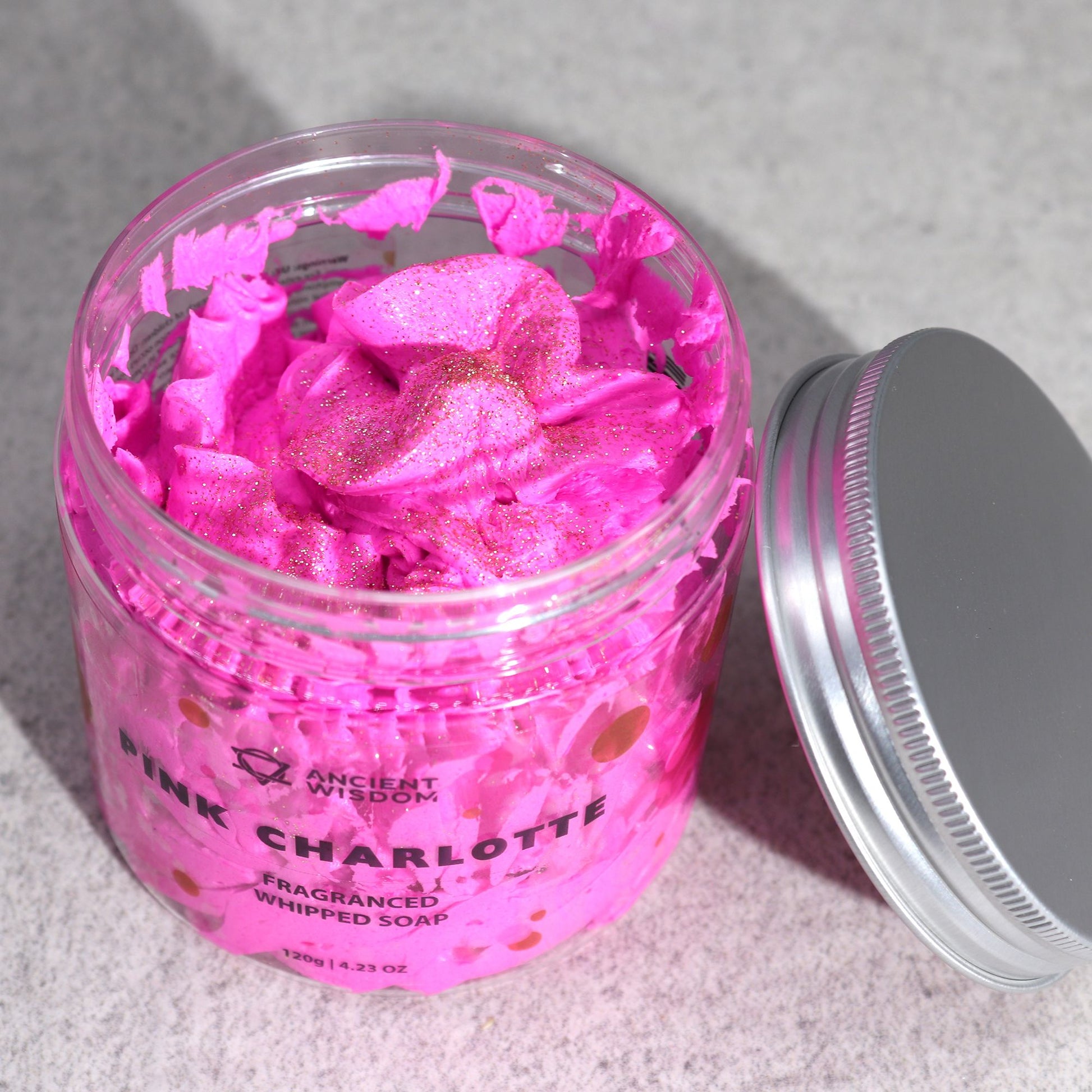 Pink Charlotte whipped soap by The Bliss Co in a 120g jar, showcasing smooth, fluffy whipped soap with a soft pink color.