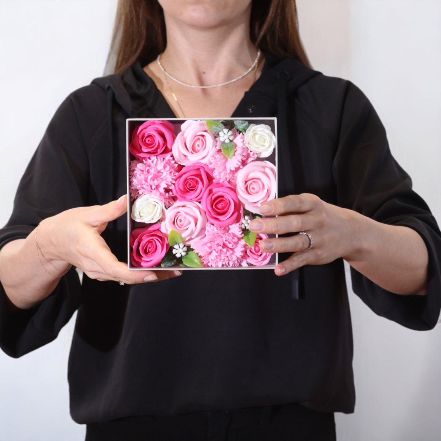 Square box of pink soap flower gift box from The Bliss Co, featuring baby blessings-themed decorative soap flowers.