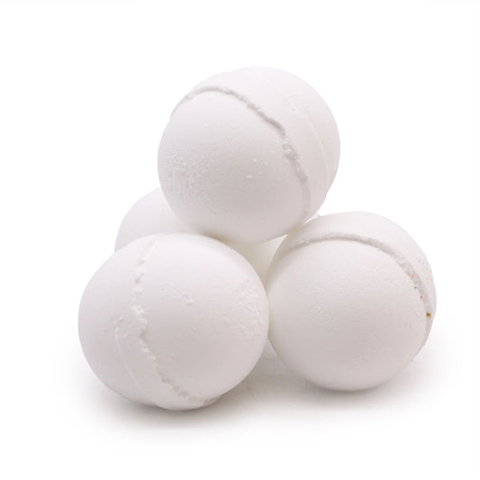 Essential Oil Bath Bomb with peppermint and eucalyptus from The Bliss Co, showing a colorful bath bomb with fresh herbs.
