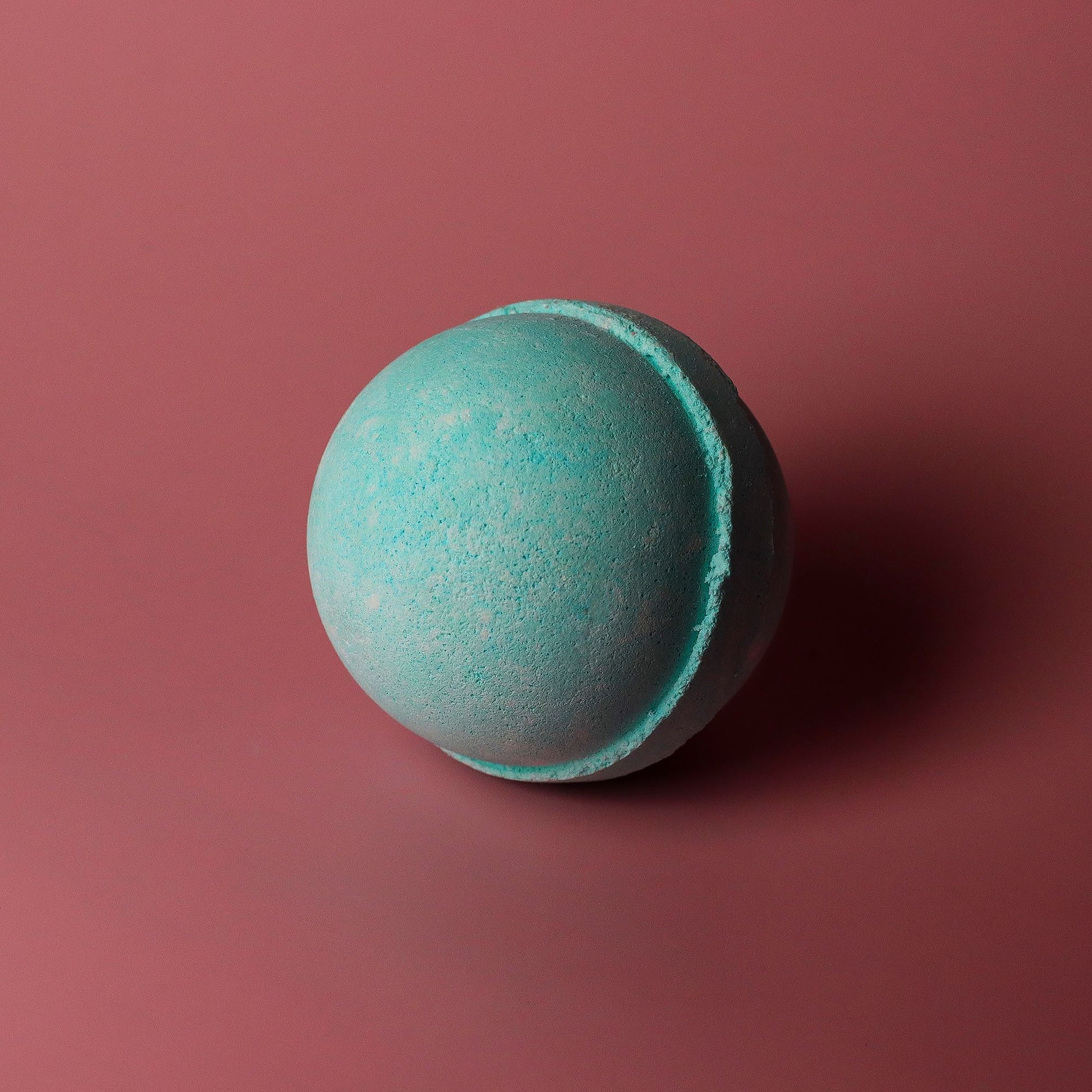 Set of three jumbo Five for Him bath bombs by The Bliss Co, 180g each, with colorful swirling designs in a relaxing bath scene.