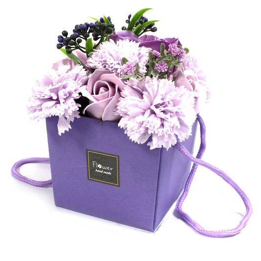 Luxury soap flower bouquet featuring lavender, roses, and carnations from The Bliss Co, arranged in a decorative floral display.