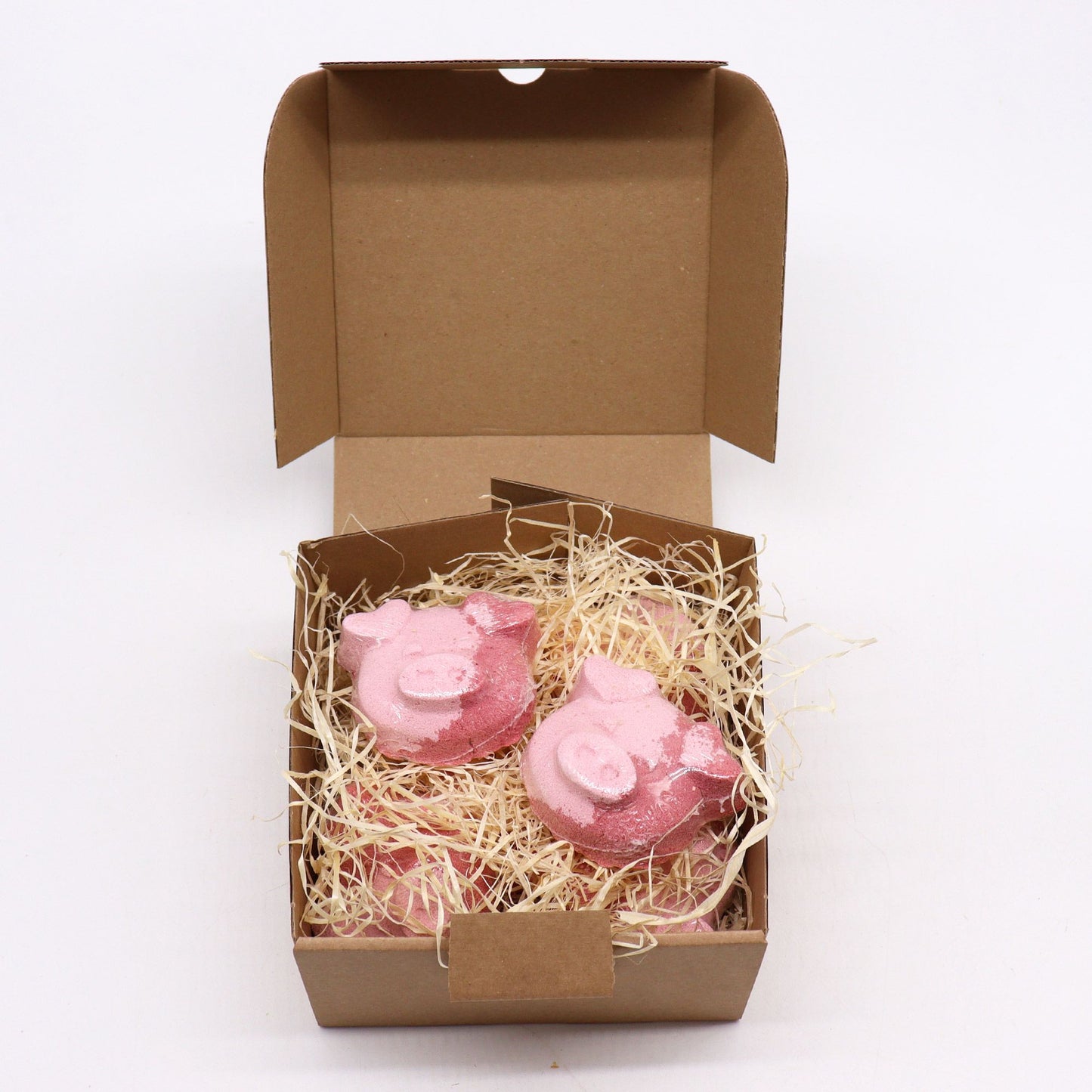 Colorful pig-shaped bath bomb for kids by The Bliss Co, 70g, perfect for fun and relaxing bath time.