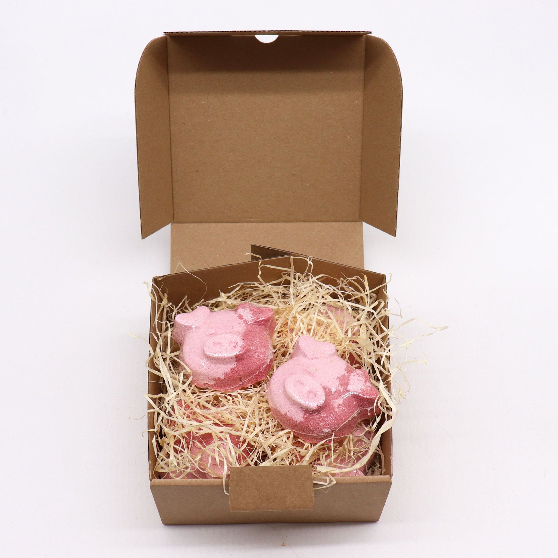 Colorful pig-shaped bath bomb for kids by The Bliss Co, 70g, perfect for fun and relaxing bath time.