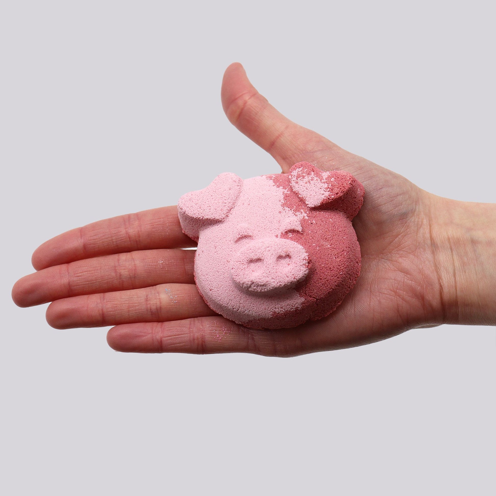 Colorful pig-shaped bath bomb for kids by The Bliss Co, 70g, designed for fun bath time experiences.